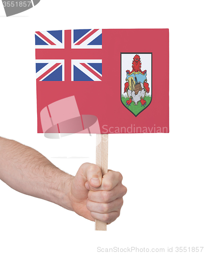 Image of Hand holding small card - Flag of Bermuda