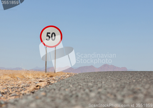 Image of Speed limit sign at a desert road in Namibia