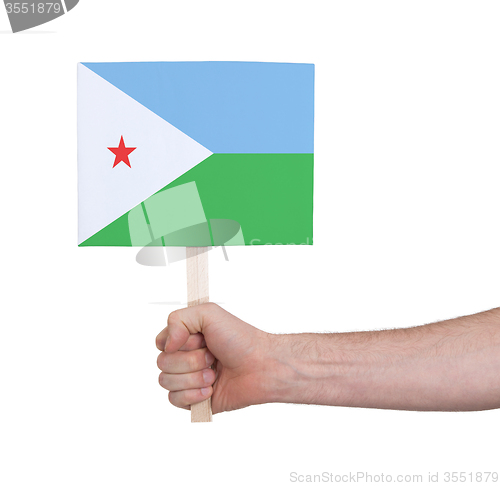 Image of Hand holding small card - Flag of Djibouti