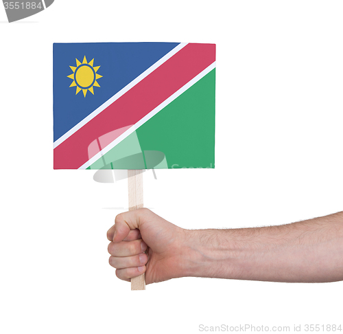 Image of Hand holding small card - Flag of Namibia