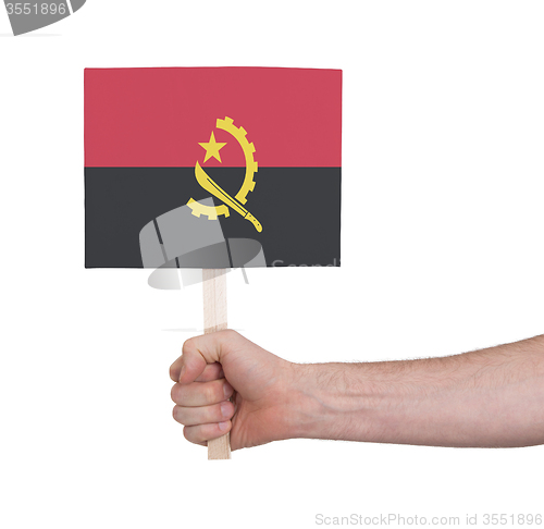 Image of Hand holding small card - Flag of Angola