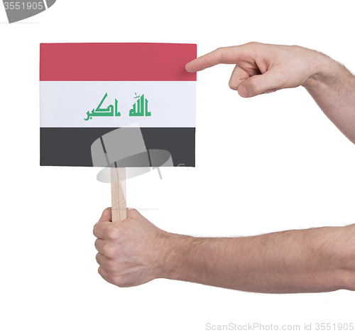 Image of Hand holding small card - Flag of Iraq