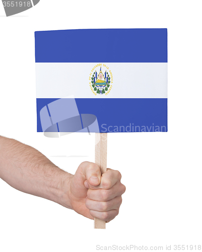 Image of Hand holding small card - Flag of El Salvador