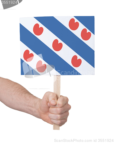 Image of Hand holding small card - Flag of Friesland