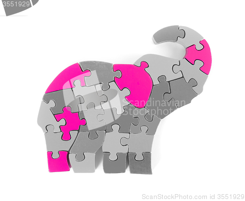 Image of Colorful puzzle pieces in elephant shape