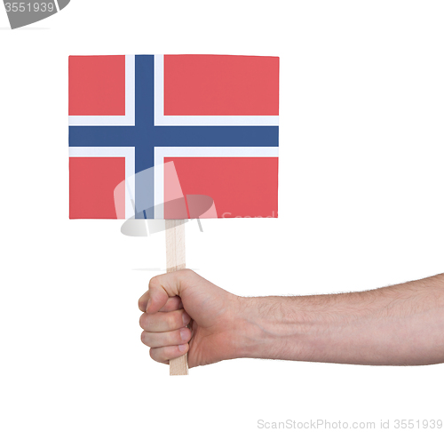 Image of Hand holding small card - Flag of Norway