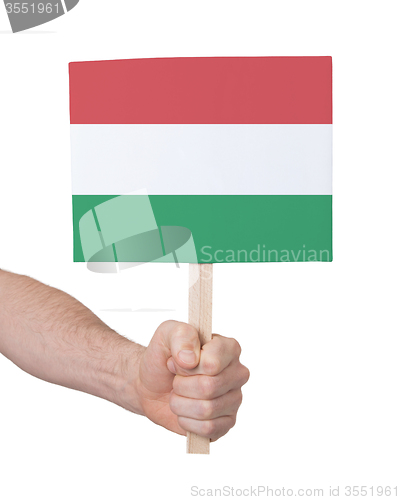 Image of Hand holding small card - Flag of Hungary