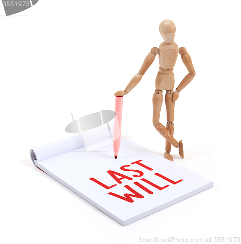 Image of Wooden mannequin writing - Last will