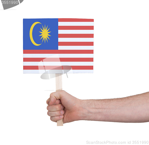 Image of Hand holding small card - Flag of Malaysia