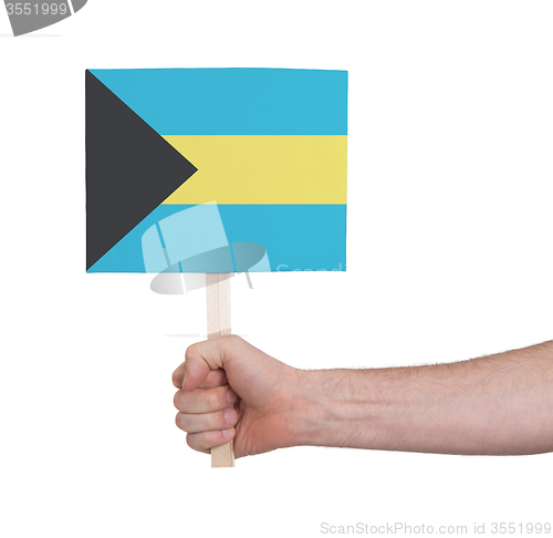 Image of Hand holding small card - Flag of Bahamas