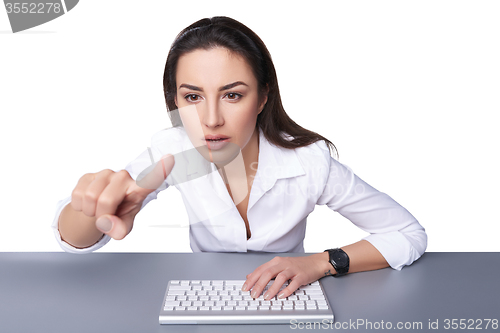 Image of Business woman pointing at imaginary button