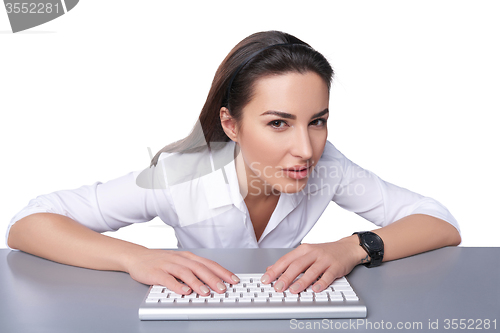Image of Business woman pointing at imaginary button