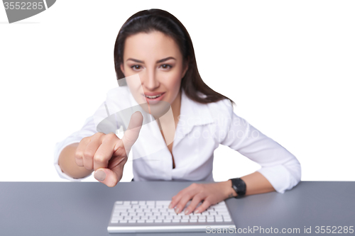 Image of Business woman pointing at imaginary button