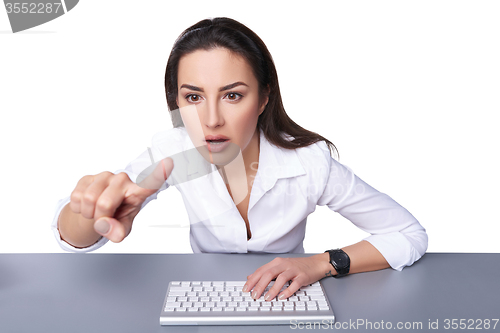 Image of Business woman pointing at imaginary button