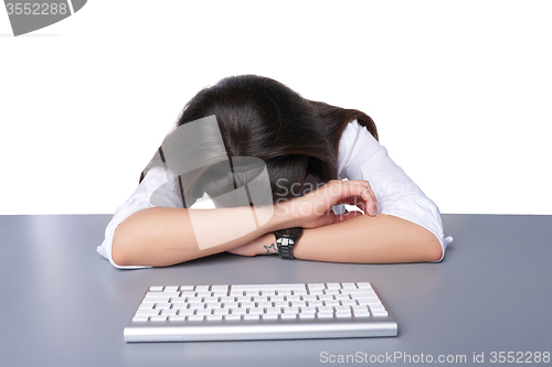 Image of Businesswoman asleep on her laptop