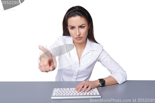 Image of Business woman pointing at imaginary button