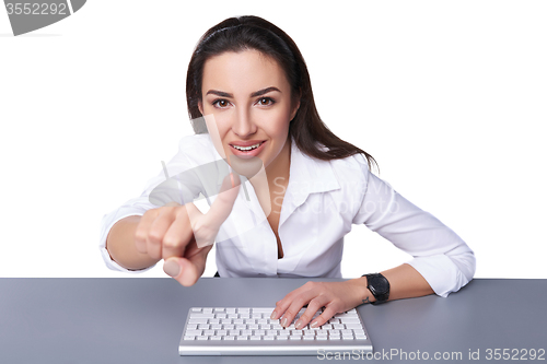 Image of Business woman pointing at imaginary button