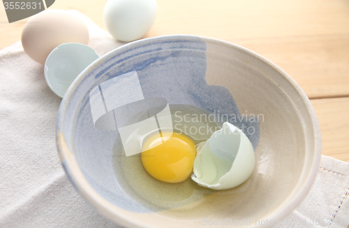 Image of broken Araucana egg in a decorative bowl