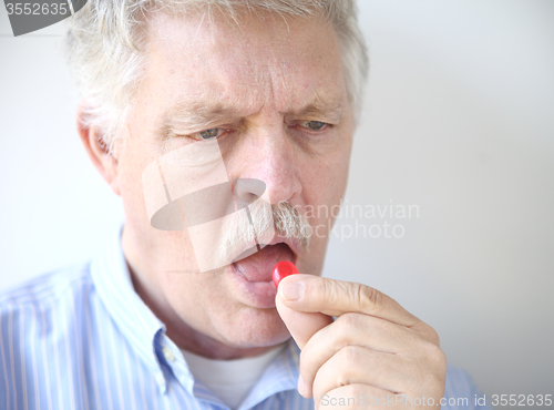 Image of senior man with cough drop