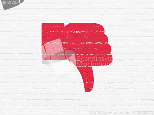 Image of Social media concept: Thumb Down on wall background