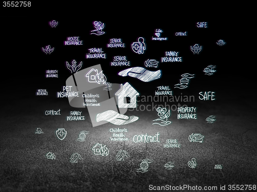 Image of Insurance concept: House And Palm in grunge dark room