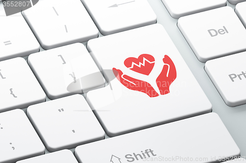 Image of Insurance concept: Heart And Palm on computer keyboard background