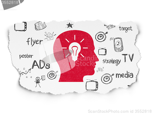 Image of Marketing concept: Head With Light Bulb on Torn Paper background