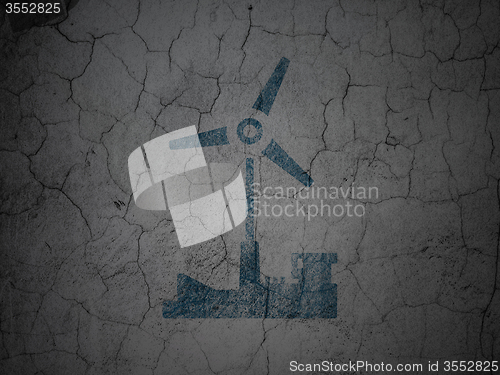 Image of Industry concept: Windmill on grunge wall background