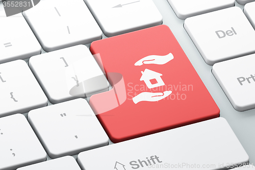Image of Insurance concept: House And Palm on computer keyboard background