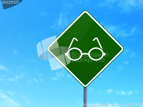 Image of Science concept: Glasses on road sign background
