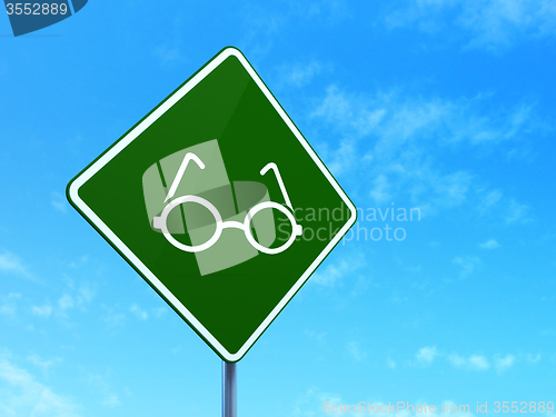 Image of Science concept: Glasses on road sign background