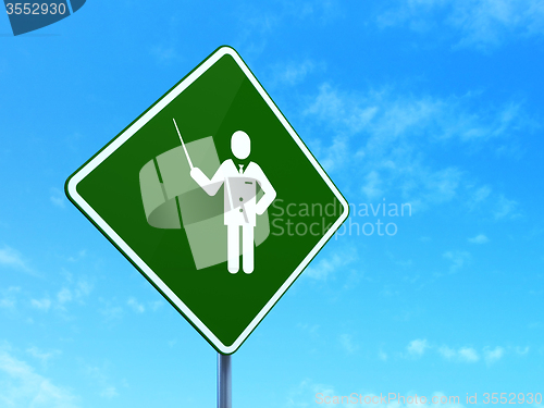 Image of Studying concept: Teacher on road sign background