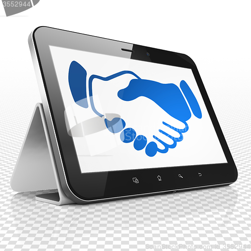 Image of Politics concept: Tablet Computer with Handshake on display