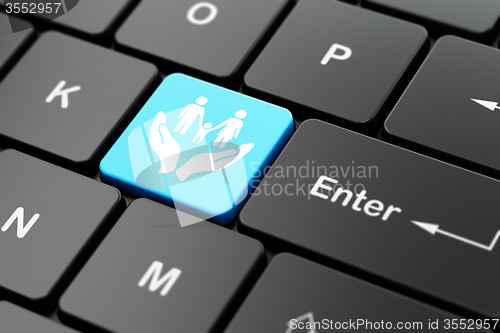 Image of Insurance concept: Family And Palm on computer keyboard background