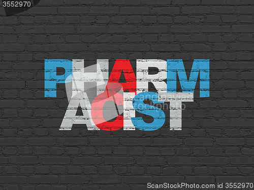 Image of Health concept: Pharmacist on wall background