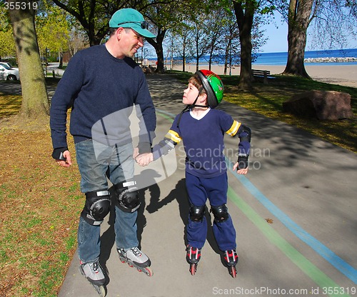 Image of Father son rollerblade