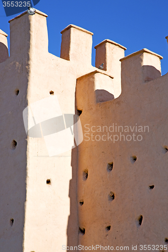 Image of brown     old ruin in     construction  and sky  near 