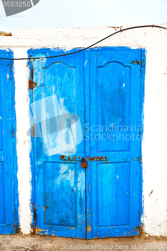 Image of in africa   old harbor wood   door and the blue sky