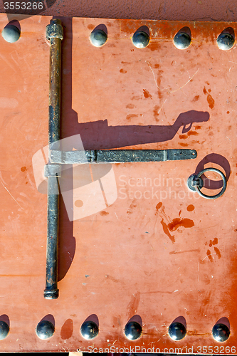 Image of metal rusty  brown    morocco in  red  facade home and 