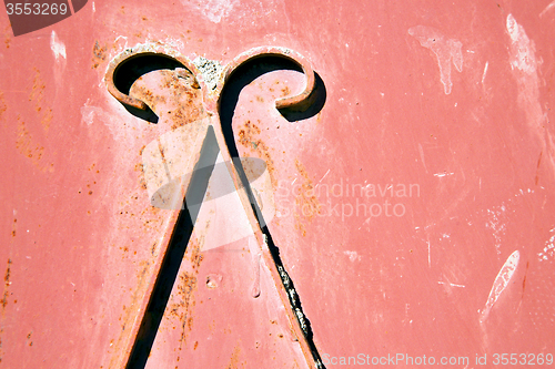 Image of red  hinges      rusty      morocco in africa 