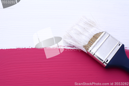 Image of Painting pink surface with white paint