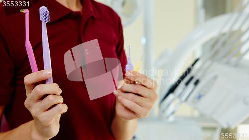 Image of hands of dentist