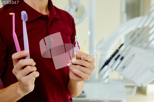 Image of hands of dentist