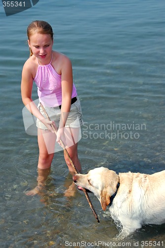 Image of Girl play dog