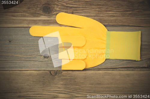 Image of gloves points his index finger