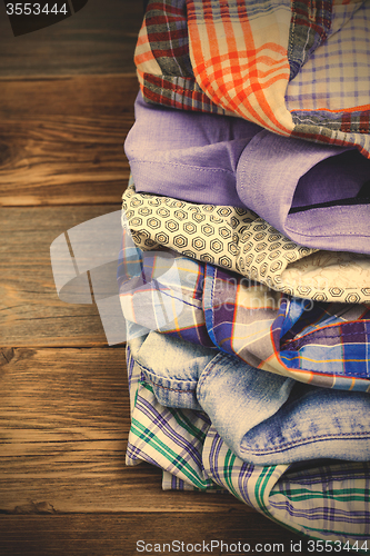 Image of stack of colored shirts