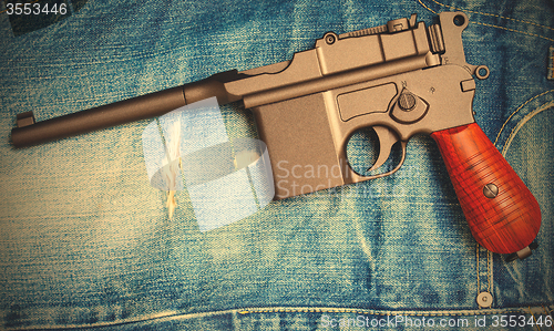 Image of Mauser submachine gun on vintage jeans