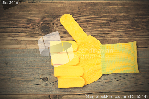Image of gloves with raised thumb up