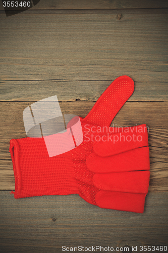 Image of gloves with raised thumb up