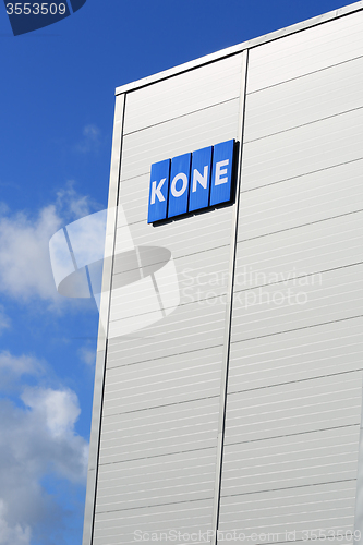 Image of KONE Building with Signage and Blue Sky Clouds, Vertical